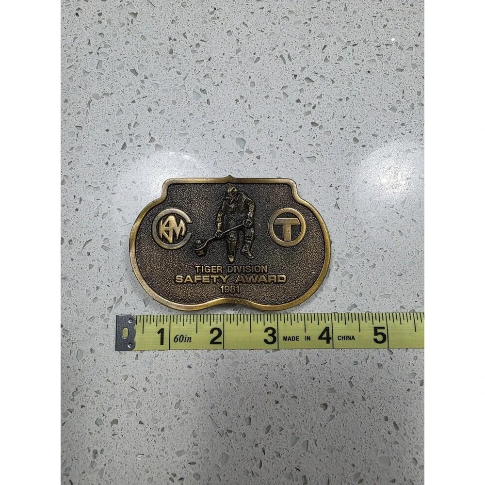 Vintage brass-toned belt buckle text 
